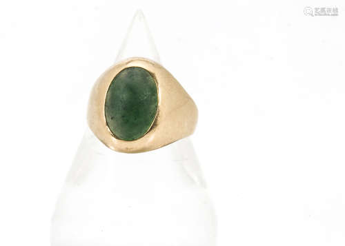 A vintage gold and emerald signet ring, the oval green stone, in need of repolishing in rubbed