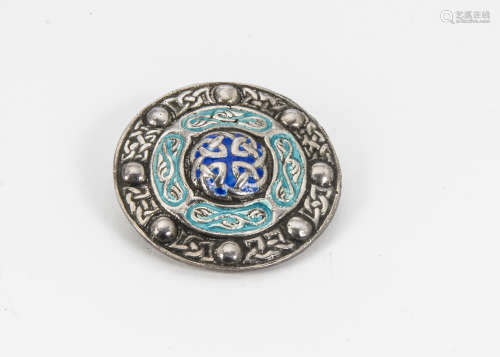 An early 20th Century silver and enamel brooch, shield shaped with Celtic motifs, Birmingham 1919 by