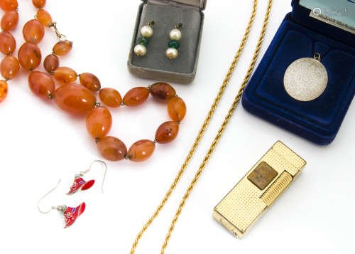 A small quantity of costume jewellery, including a 15ct gold garnet set stick pin, a silver dress