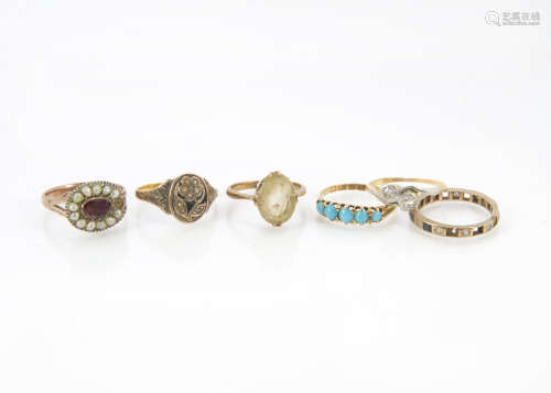 A collection of six Victorian and later gold and gem set rings, including an 18ct gold and five
