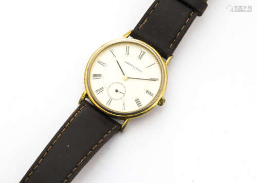 A modern Hamilton gilt and stainless steel gentleman's wristwatch, 33mm case, ref. 6210, on dark