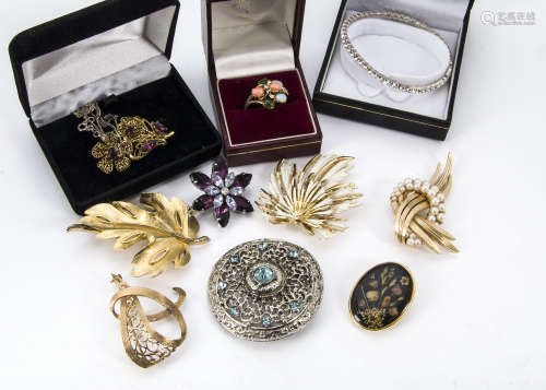 A collection of jewellery, including various gilt and other jewels such as an owl and a fox