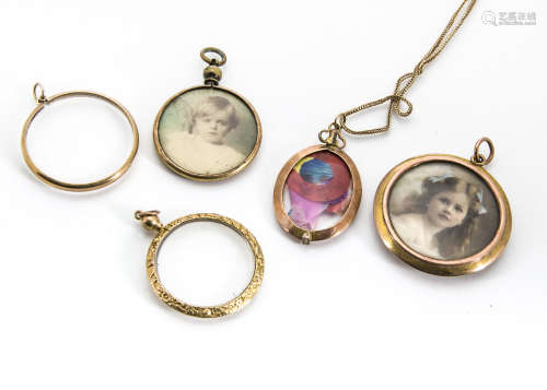 A collection of gold and base metal open lockets, one with photographic portrait of a young girl