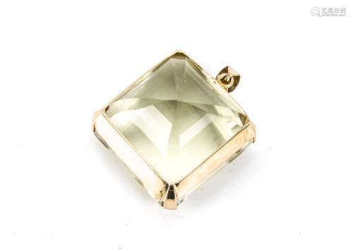 A very large citrine pendant, the square step cut green tinged stone in a high carat frame mount