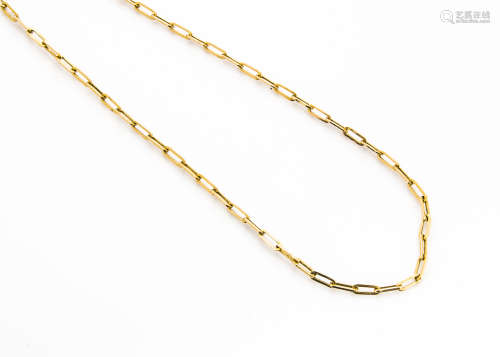 A vintage Middle Eastern yellow metal necklace, the high carat gold chain of oblong links with S