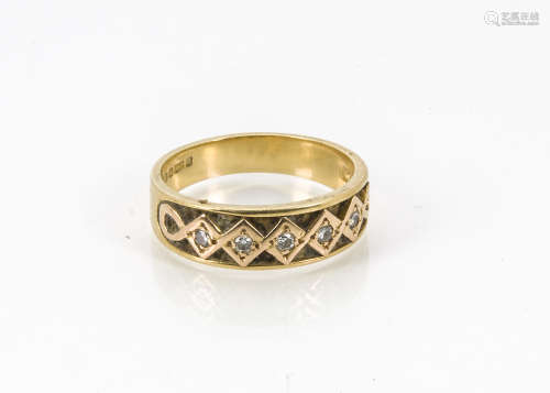 A modern 18ct gold and diamond ring, the tapered band with five brilliant cuts in zig zag setting,