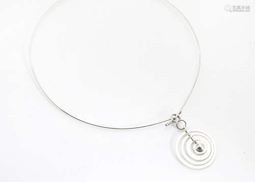 A silver modernist Finnish pendant, after a design by Tapio Werkkala, the four graduating circles