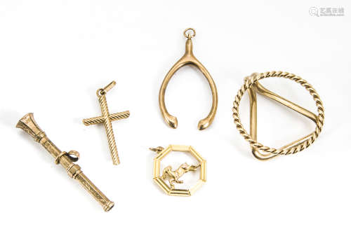 Three 9ct gold pendants, including a crucifix, an Aries ram and a wishbone, together with a yellow