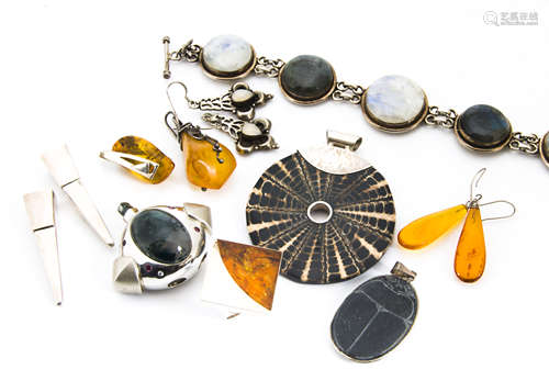 A collection of contemporary amber and hardstone set silver jewellery, including a modern amber