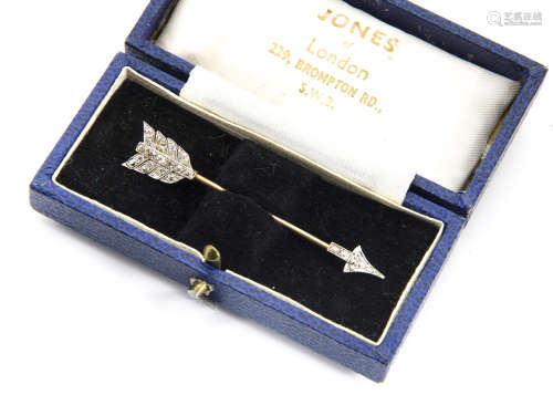 An early 20th Century gold and platinum diamond set stick pin, the old cut stones in millegrain