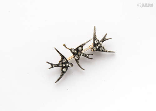 An Edwardian diamond set swallow bar brooch, the rough cut diamonds set to bodies and wings on a