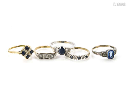 Five gold rings, one white metal with three stones marked 14k, a sapphire and diamond example, an