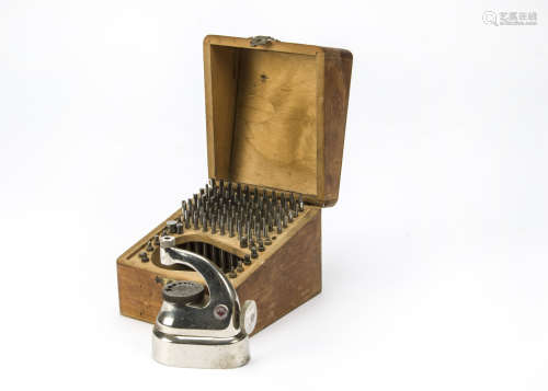 A vintage watch staking set by Favorite, in wooden box, lacks one punch