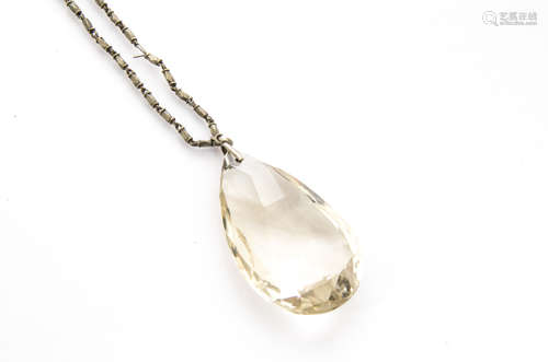 A large tear cut citrine drop pendant, on a white metal chain, pendant 5.8cm x 3.2cm