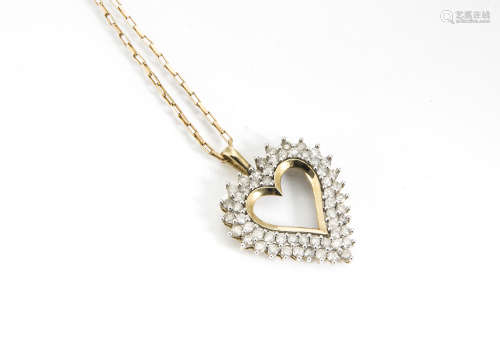 A 9ct gold diamond set heart shaped pendant, and chain, the multiple brilliant cuts in claw