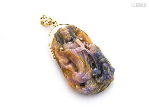 A Chinese fluorite carved gold set pendant, carved as an immortal standing in long robes within a