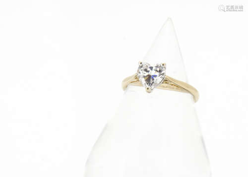 A contemporary cubic zirconia 14ct gold dress ring, with heart shaped cut stone in three claw