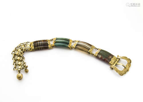 A Victorian silver gilt and agate buckle bracelet, the four carved curved panels with engraved