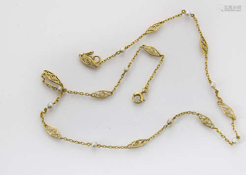 An art deco gold and seed pearl fine chain necklace, the navette shaped scroll links alternately