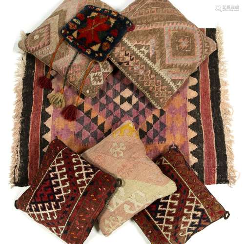 Two small Kilim rugs five Kilim and Belush cushions and a small saddle bag