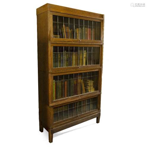 Oak stacking bookcase by Kenrick & Jefferson, with four leaded shelves, 162cm x 86.5cm