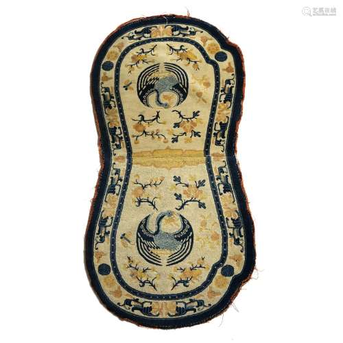 Chinese saddle rug ivory ground with two phoenix and other long life symbols, 139cm x 73cm
