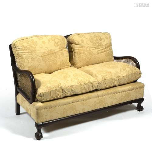 Mahogany and cane Bergere sofa with loose cushions, 137cm across