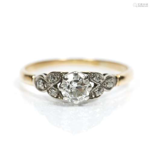 Diamond solitaire ring with brilliant cut stone with further diamond to shoulders