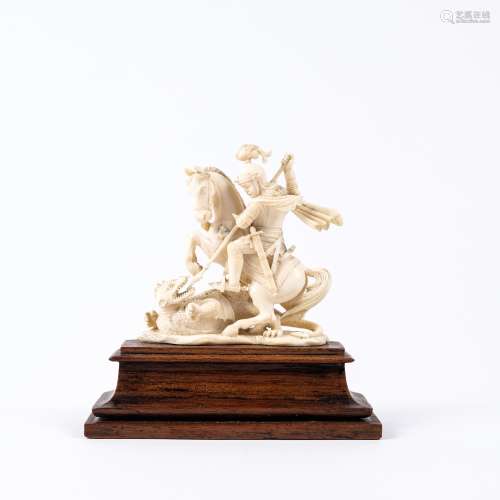 Carved ivory figure of St. George slaying the dragon, on a wooden plinth circa 1900, 9cm high