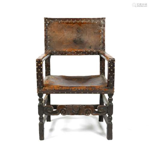 Cromwellian leather chair circa 1660, with brass studded backs and seats, 101cm high x 62cm across