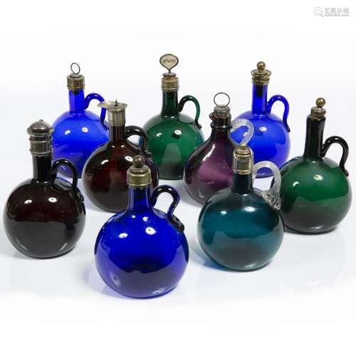 Three Bristol blue decanters Late 19th century, with brass mounts, together with six further