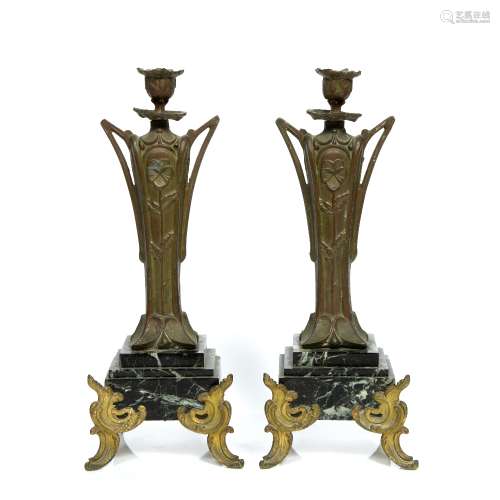 Pair of metal candle sticks in the Art Nouveau style, on coloured marble bases, 33.5cm high (2)
