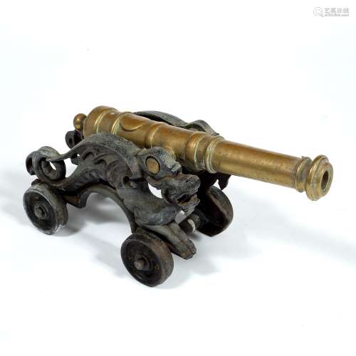 Model cannon on an iron platform, 48cm long