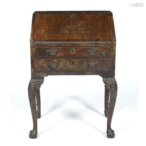 Walnut and cross banded small bureau early 18th Century and later, with fitted interior, fitted