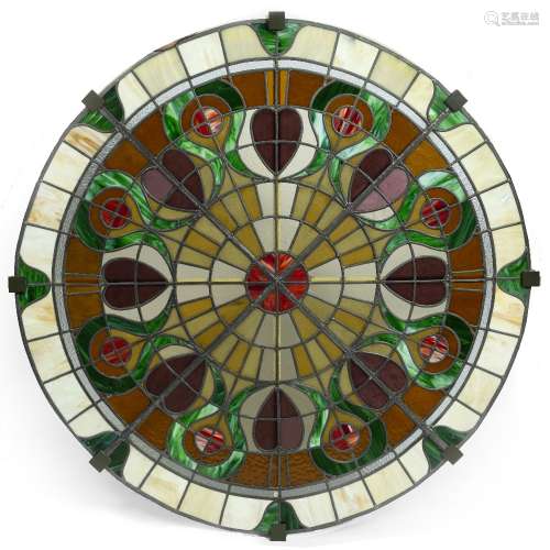 Large leaded glass round panel 20th Century, split into small sections decorated in different