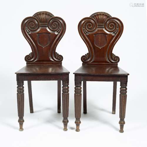 Pair of carved mahogany hall chairs early 19th Century, 87cm