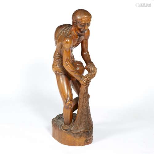 Carved standing fisherman Balinese, 74cm high