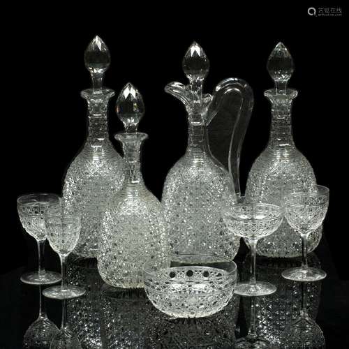 Suite of cut glass hobnail design comprising three decanters, largest 32cm , ewer and stopper, seven