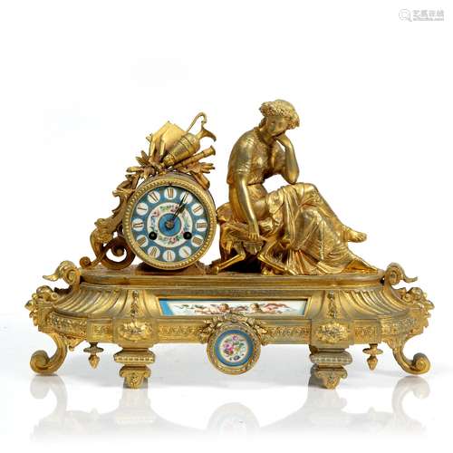 French gilt metal mantel clock 19th Century, with inset porcelain panels, 42cm across