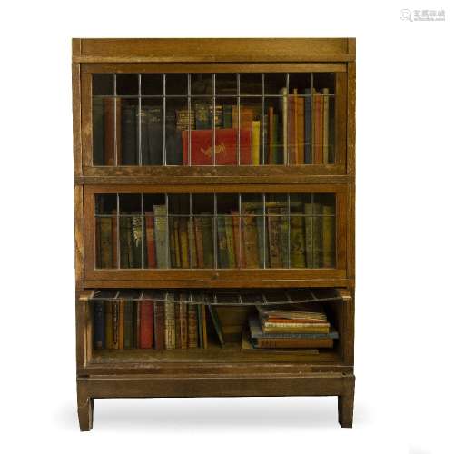 Oak stacking bookcase by Kenrick & Jefferson, with three leaded glass shelves, 87cm across, 127cm