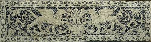 Nottingham type lace work panel depicting two griffins, framed, 41cm x 145cm