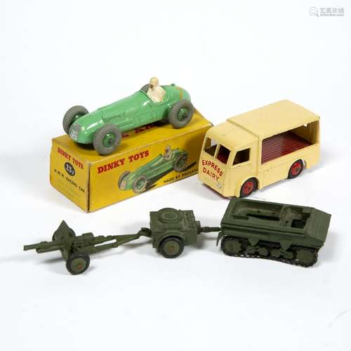 Boxed Dinky H.W.M. racing car Dinky milk float 'Express Dairy' and three Army vehicles