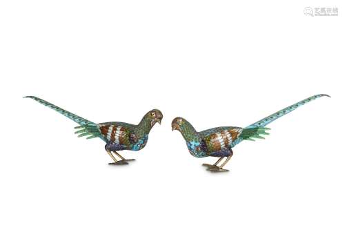 A PAIR OF CHINESE ENAMELLED PHEASANTS. Each with a long tail and brightly enamelled plumage, with