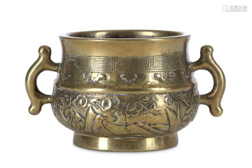 A CHINESE BRONZE INCENSE BURNER. 17th Century. The compressed ovoid body cast with two handles
