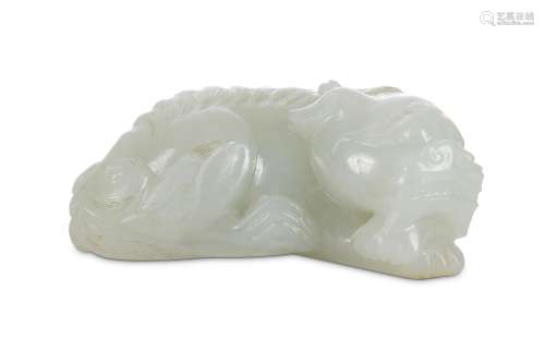 A CHINESE PALE CELADON JADE 'QILIN' CARVING. Qing Dynasty. The recumbent beast resting his head on