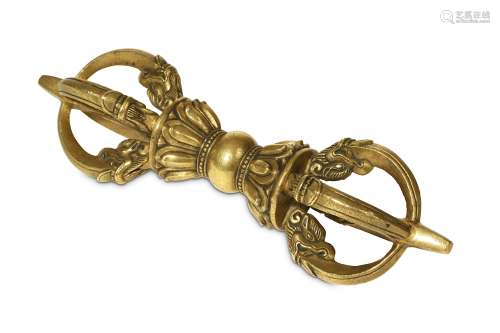 A TIBETAN BRONZE VAJRA. 19th/20th Century. With eight prongs radiating to each end emerging from a