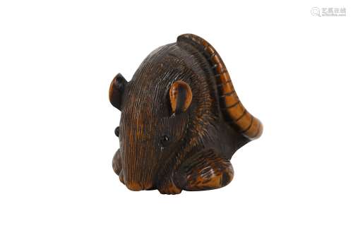 A WOOD NETSUKE OF A MOUSE. 19th Century. Seated over a large chestnut held with both forepaws,