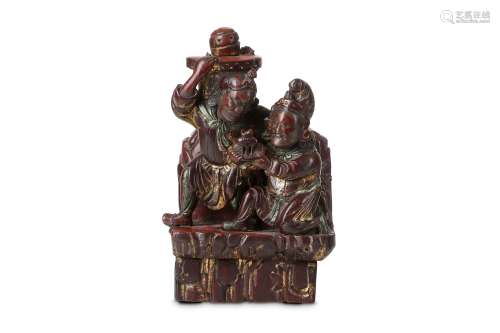 A CHINESE GILT LACQUER FIGURAL GROUP. Qing Dynasty. Carved with two figures on a rocky outcrop