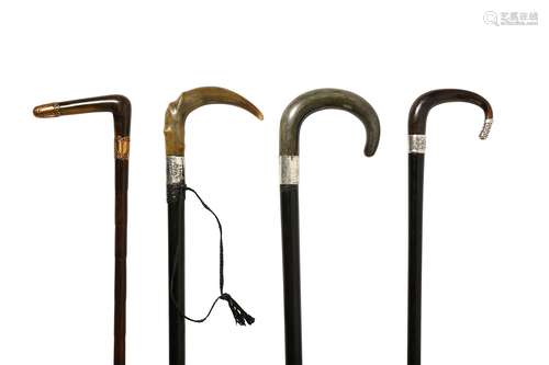 FOUR WALKING STICKS WITH RHINOCEROS HORN HANDLE.  Circa 1900. 85-93cm long. (4) 約一九零零   嵌犀角拐杖七只