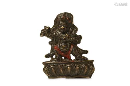 A TIBETAN BRONZE FIGURE OF BEGTSE CHEN. 19th Century. The deity standing in a dynamic pose on a